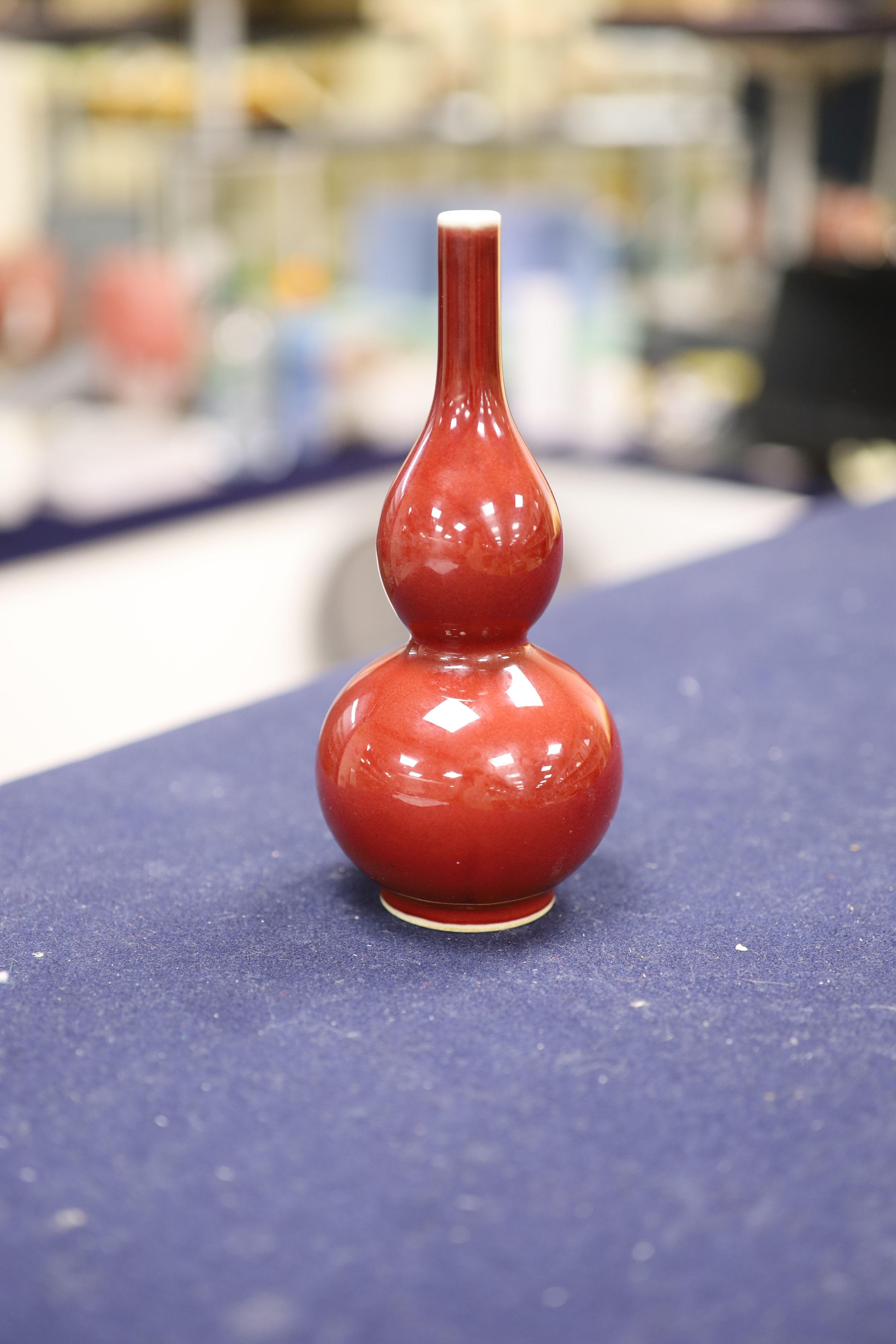 A Chinese copper red glazed double gourd vase, height 17cm